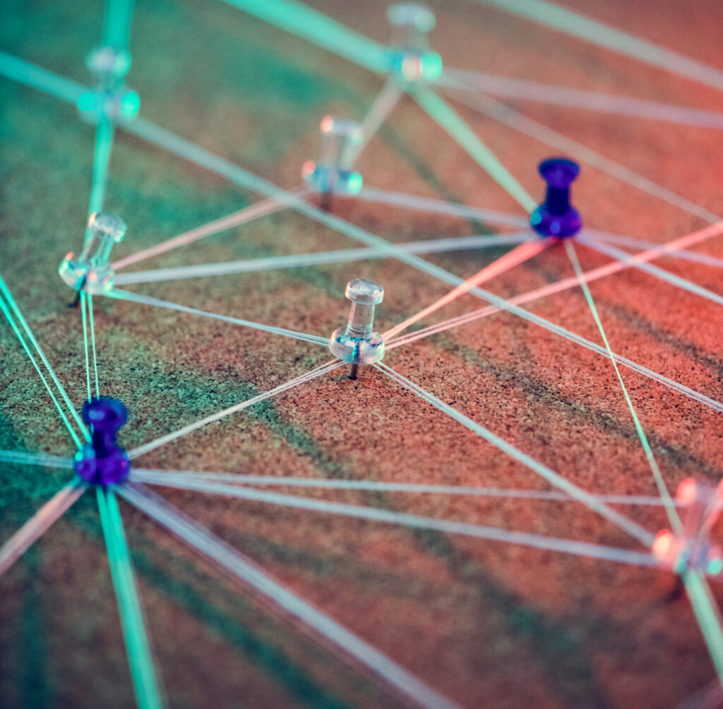 Pins arranged in a map pattern showing connectedness