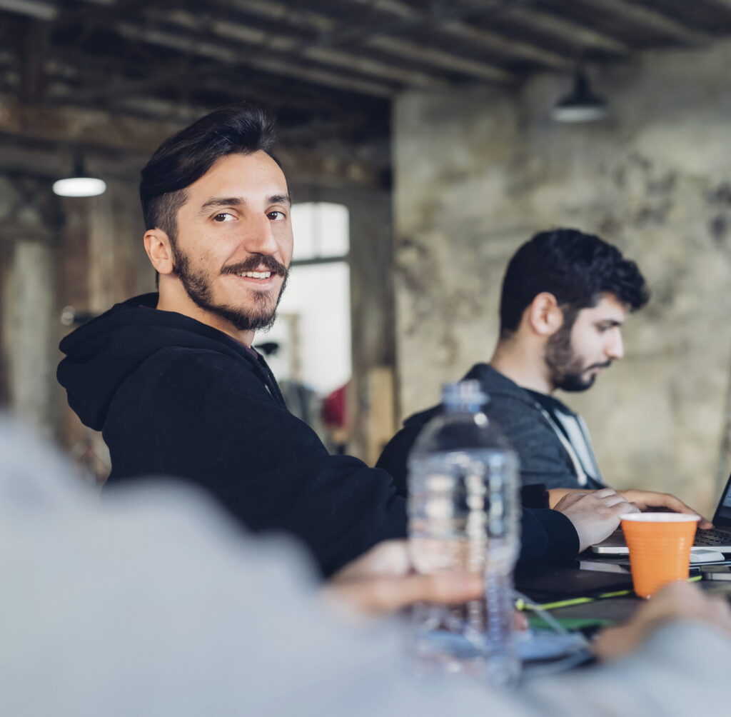 Men collaborate in a modern office workplace environment